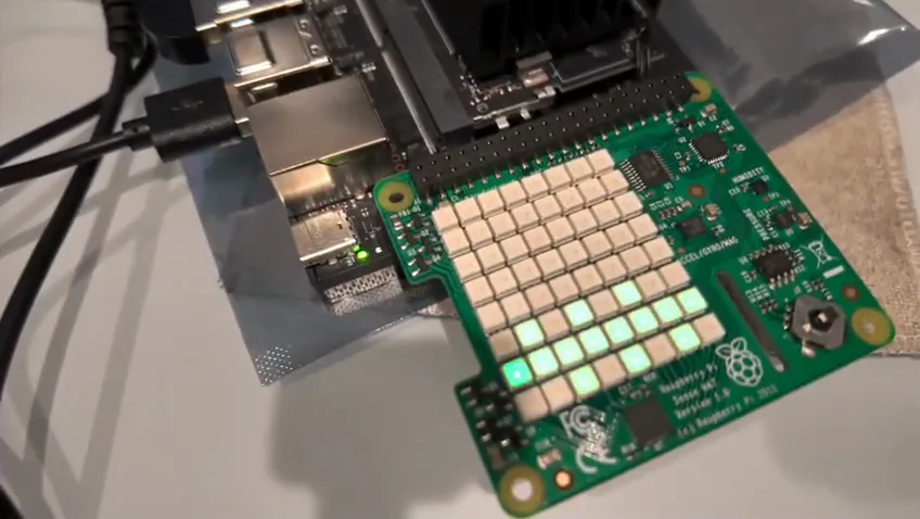 A close view of the Sense HAT connected to the Jetson, with a pattern lit on its LED matrix.