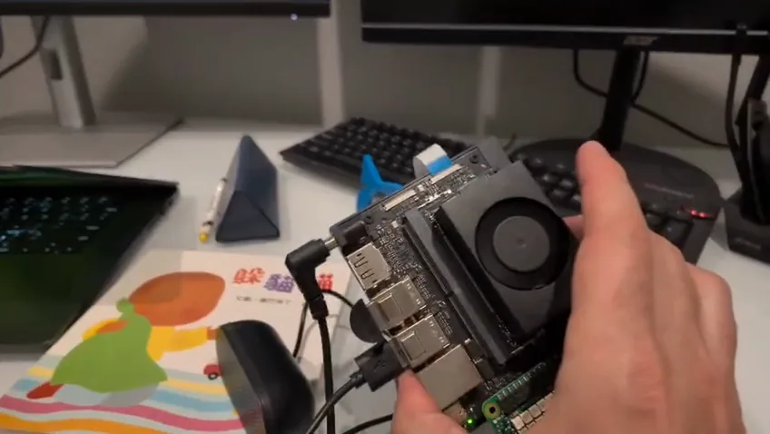 Holding the Jetson prototype at an angle during a handheld tilt test.
